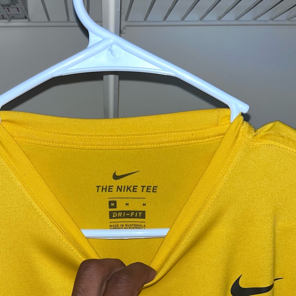 Yellow dri fit Nike shirt never worn sits in closet